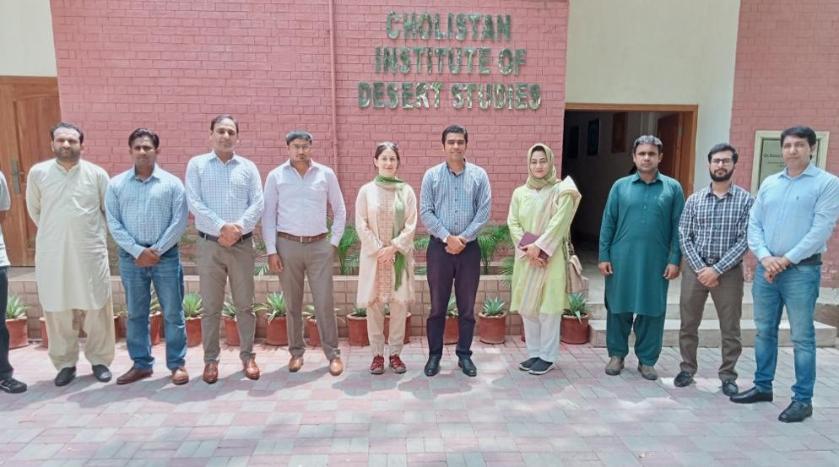 Lindsay Stringer standing with staff from Cholistan Inst of Desert Studies